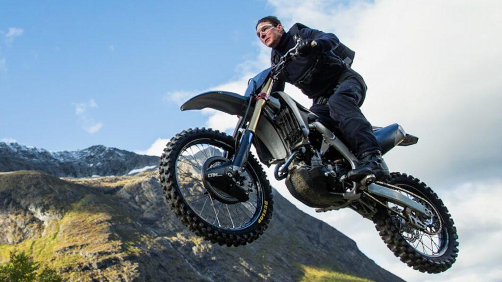 (watch): ‘Mission: Impossible 7’ cast live reactions as Tom Cruise rides a motorbike off a cliff in a dangerous stunt.